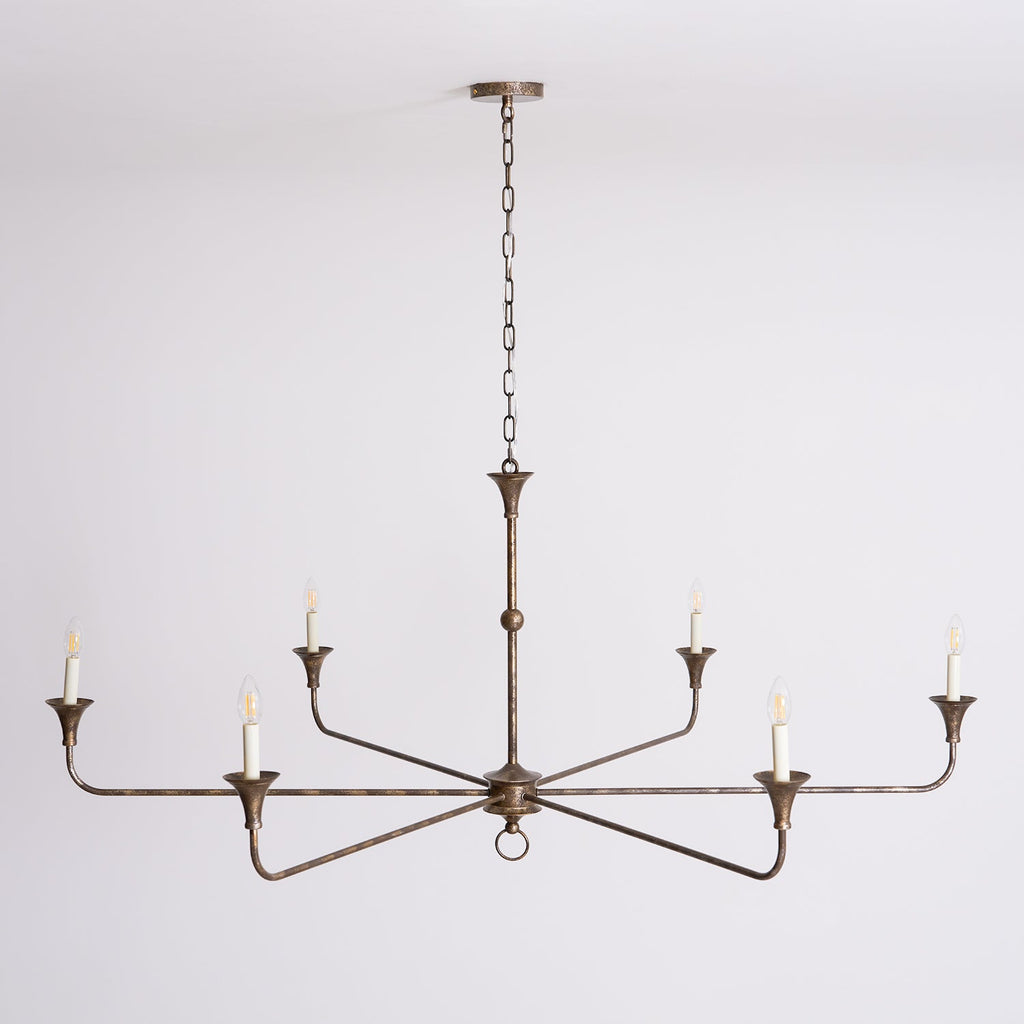 Candle chandelier shown against a plain backdrop