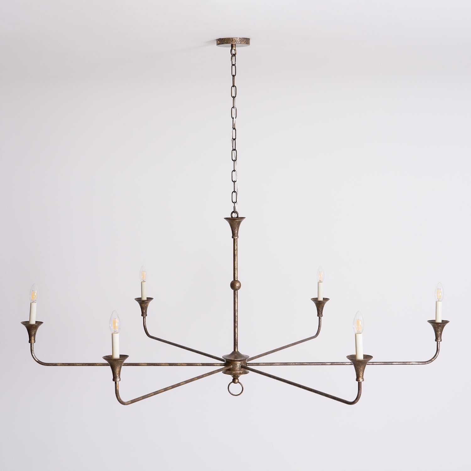 Candle chandelier shown against a plain backdrop