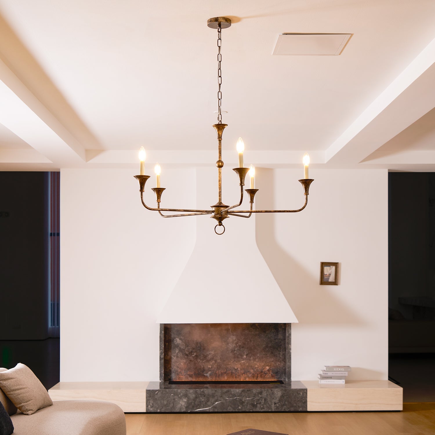 Candle chandelier shown from below with arms radiating outward