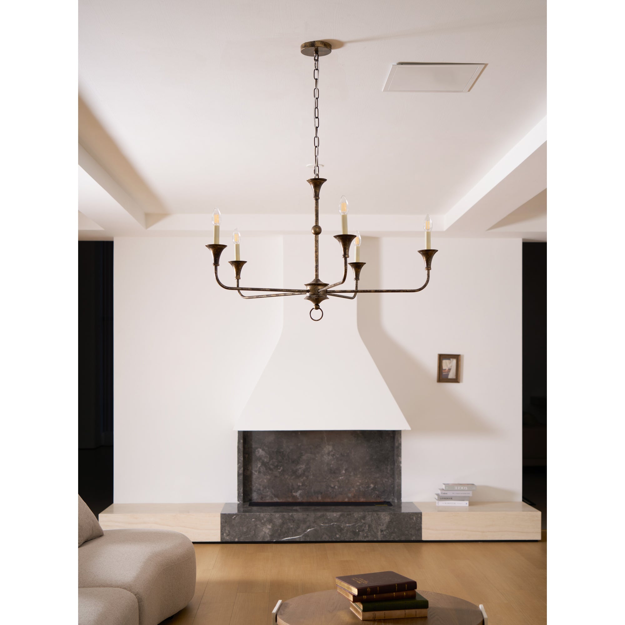 Candle chandelier full view with exposed candle-style bulbs