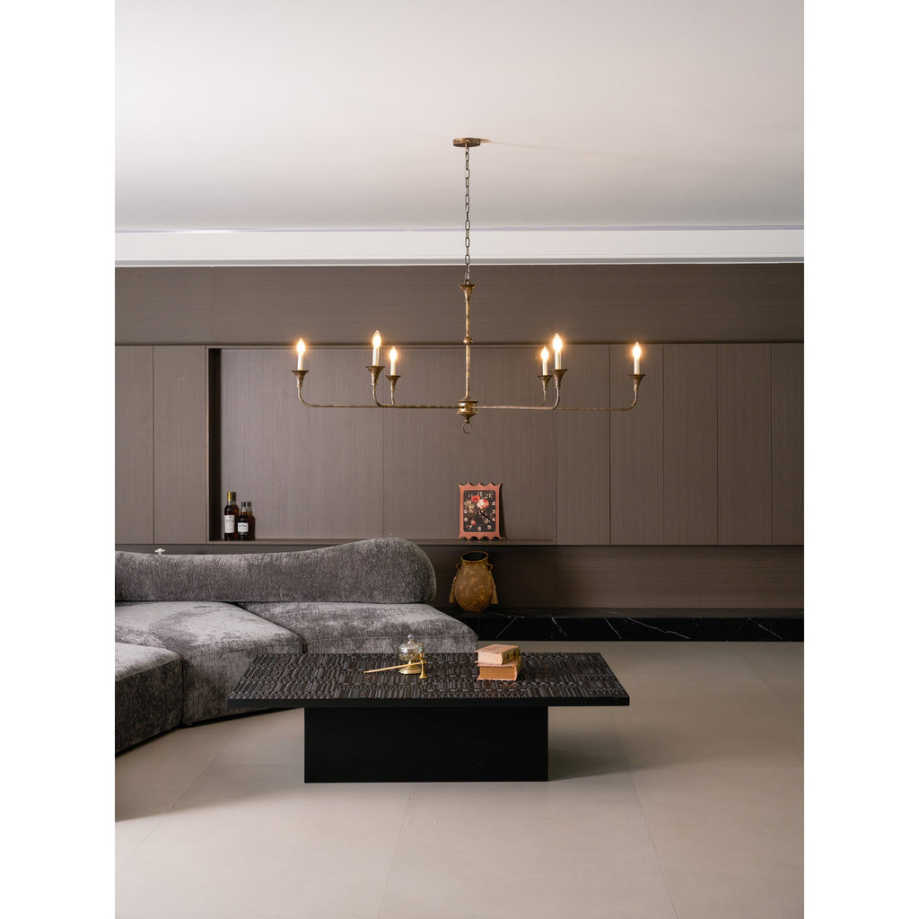 Candle chandelier illuminated in a warm room setting