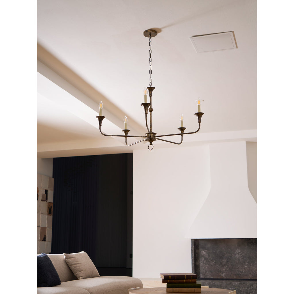 Candle chandelier illuminated with warm candle-style light