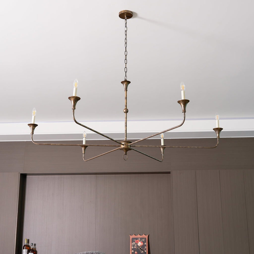 Candle chandelier shown from below with arms radiating outward