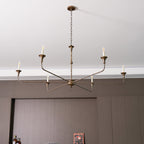 Candle chandelier shown from below with arms radiating outward
