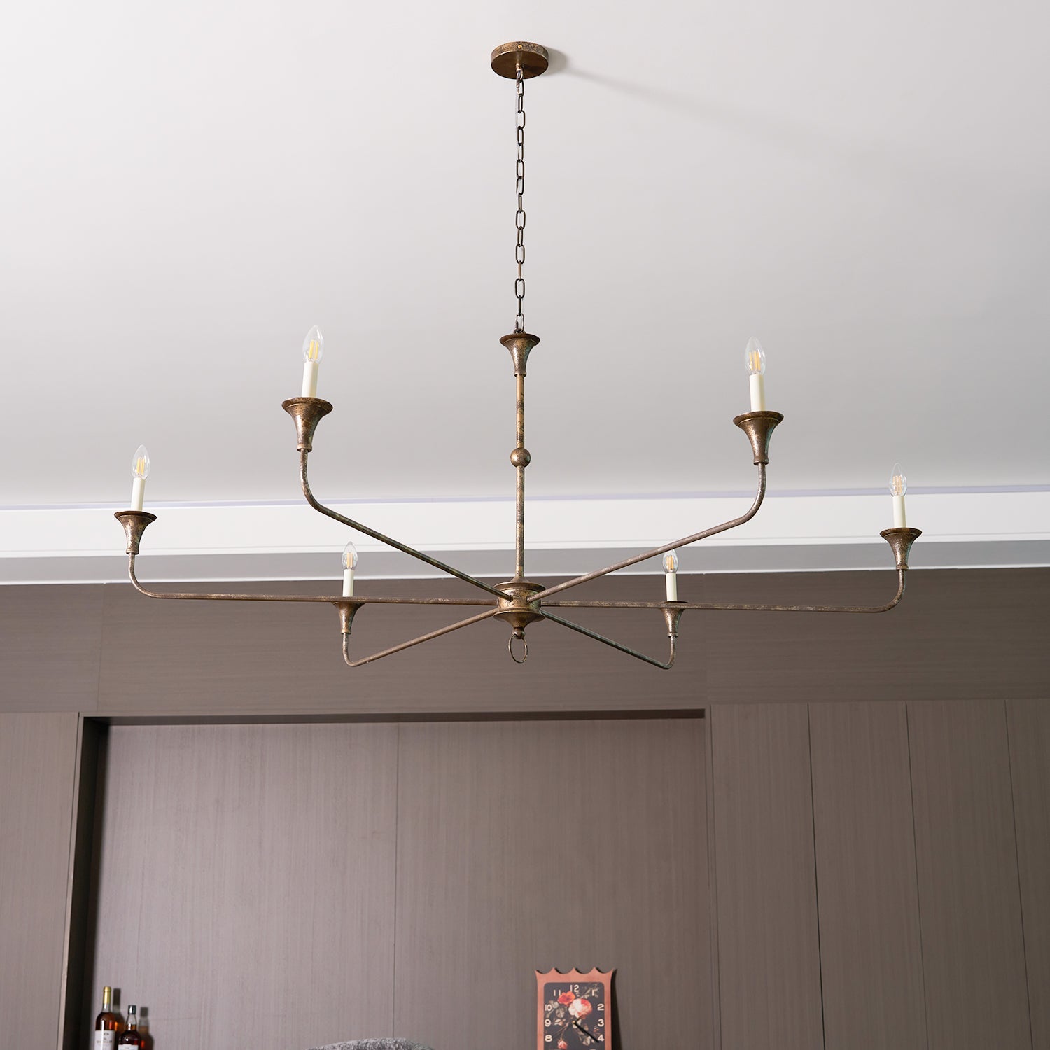 Candle chandelier shown from below with arms radiating outward