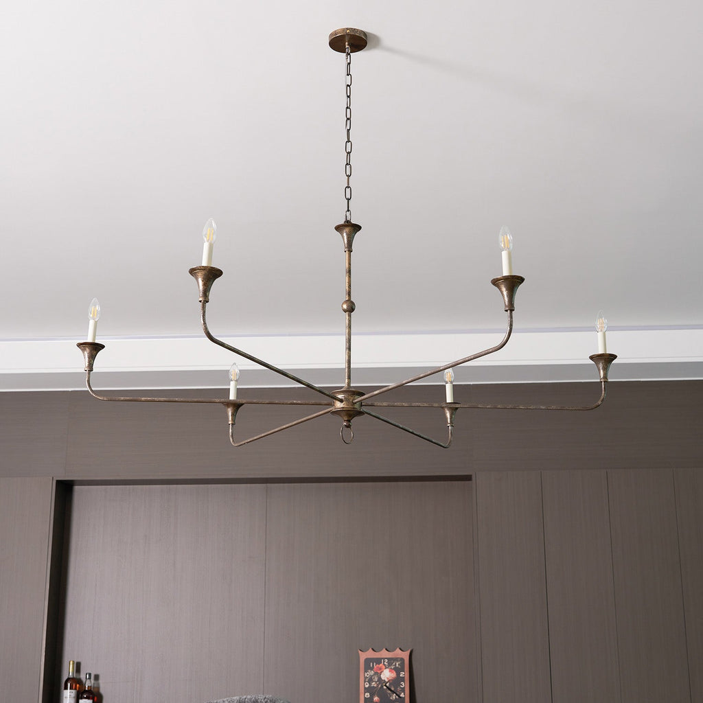 Candle chandelier detail of brass arm curvature