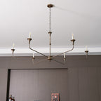 Candle chandelier detail of brass arm curvature