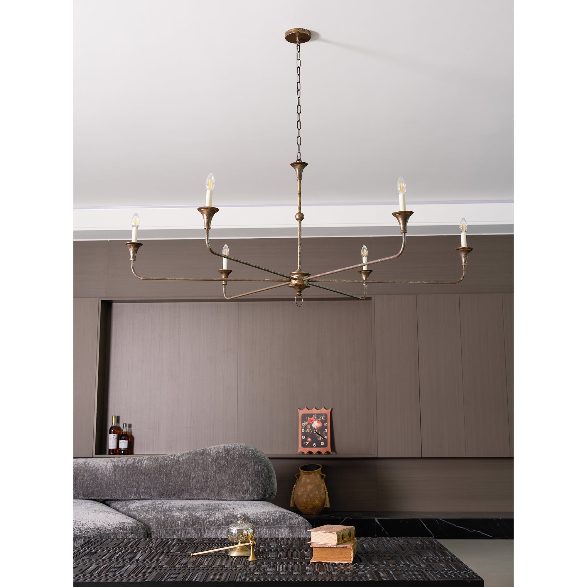 Candle chandelier shown without bulbs to highlight the brass frame