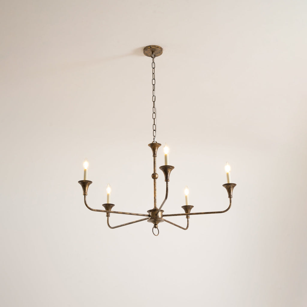 Candle chandelier detail showing exposed candle bulb fittings