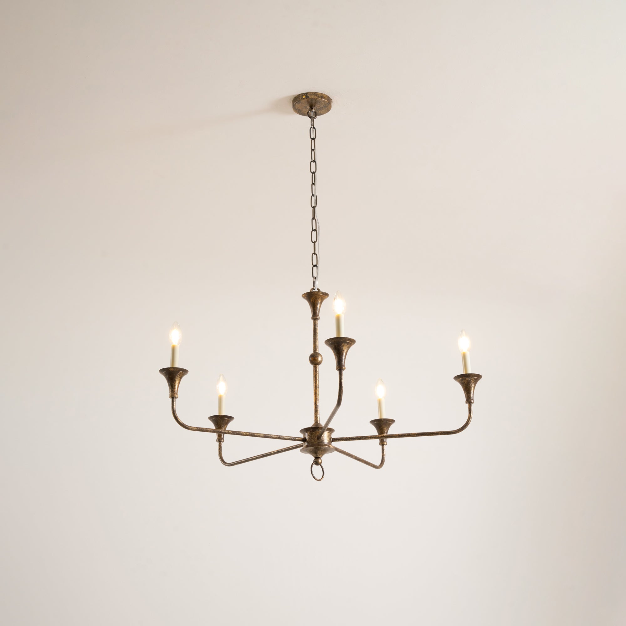 Candle chandelier detail showing exposed candle bulb fittings