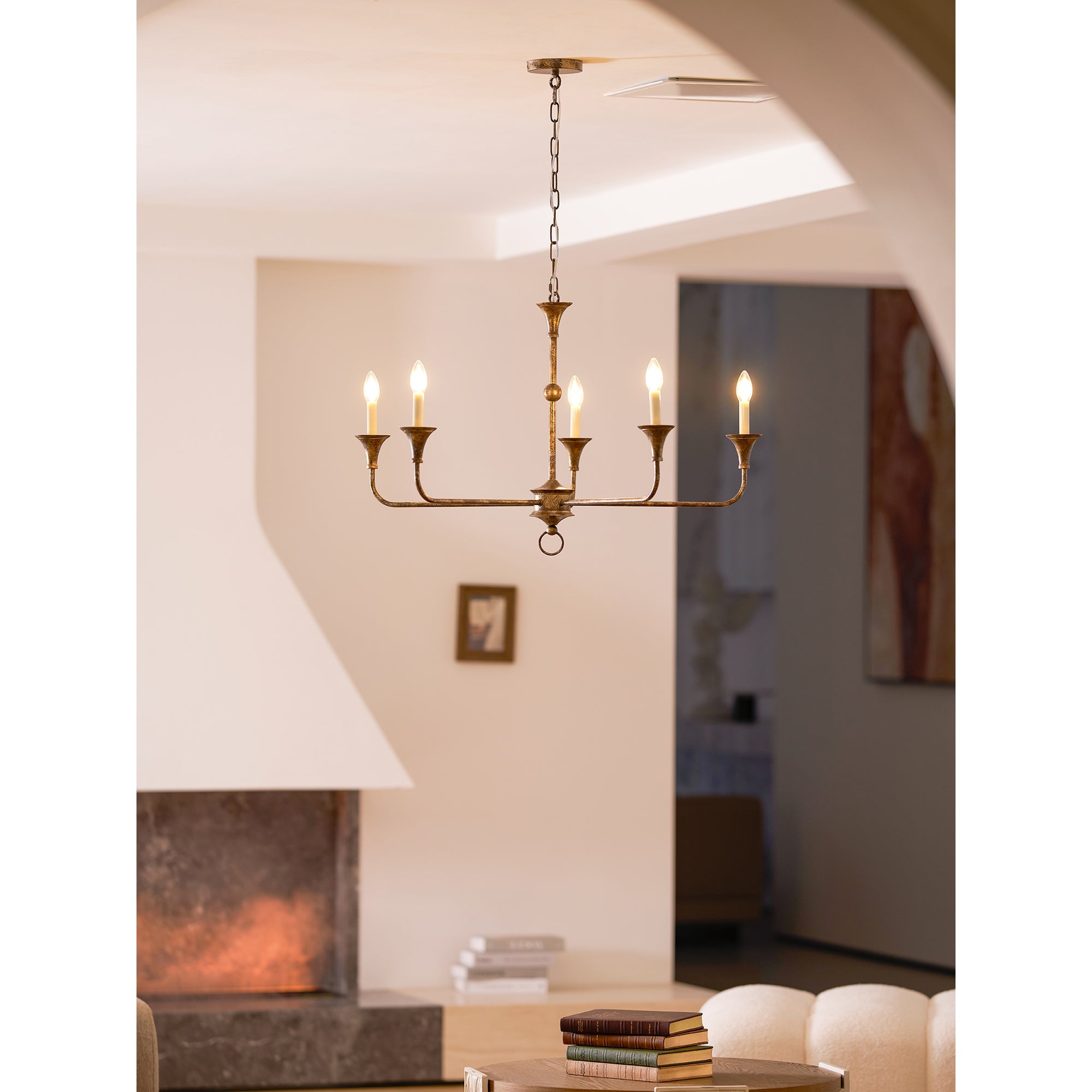 Candle chandelier shown at an angle in a styled room