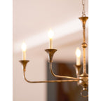Candle chandelier arm and bulb fitting close-up