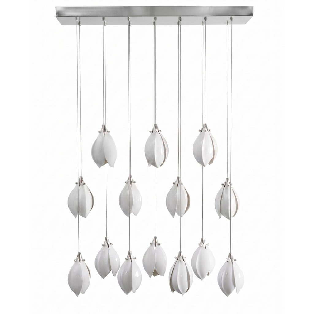 Ceramic flower pendant light arrangement with glowing white blooms