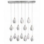 Ceramic flower pendant light arrangement with glowing white blooms