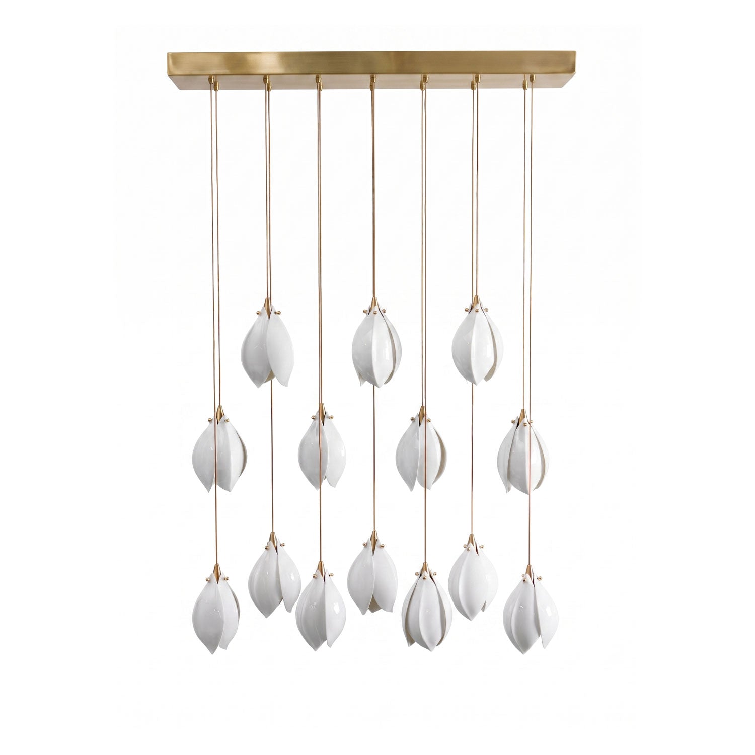 White ceramic flower pendant light glowing over a living space