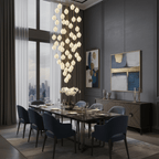 Ceramic flower pendant light with brass canopy on a pale background