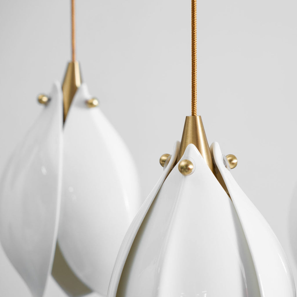 Brass and white ceramic flower pendant light single bloom detail