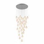Ceramic bloom pendant light showing brass arm and white shade