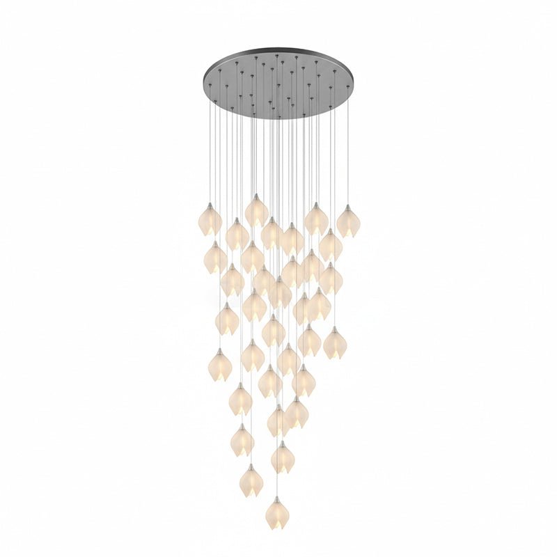 Ceramic bloom pendant light showing brass arm and white shade