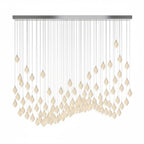 Ceramic flower pendant light close-up showing brass and white finish