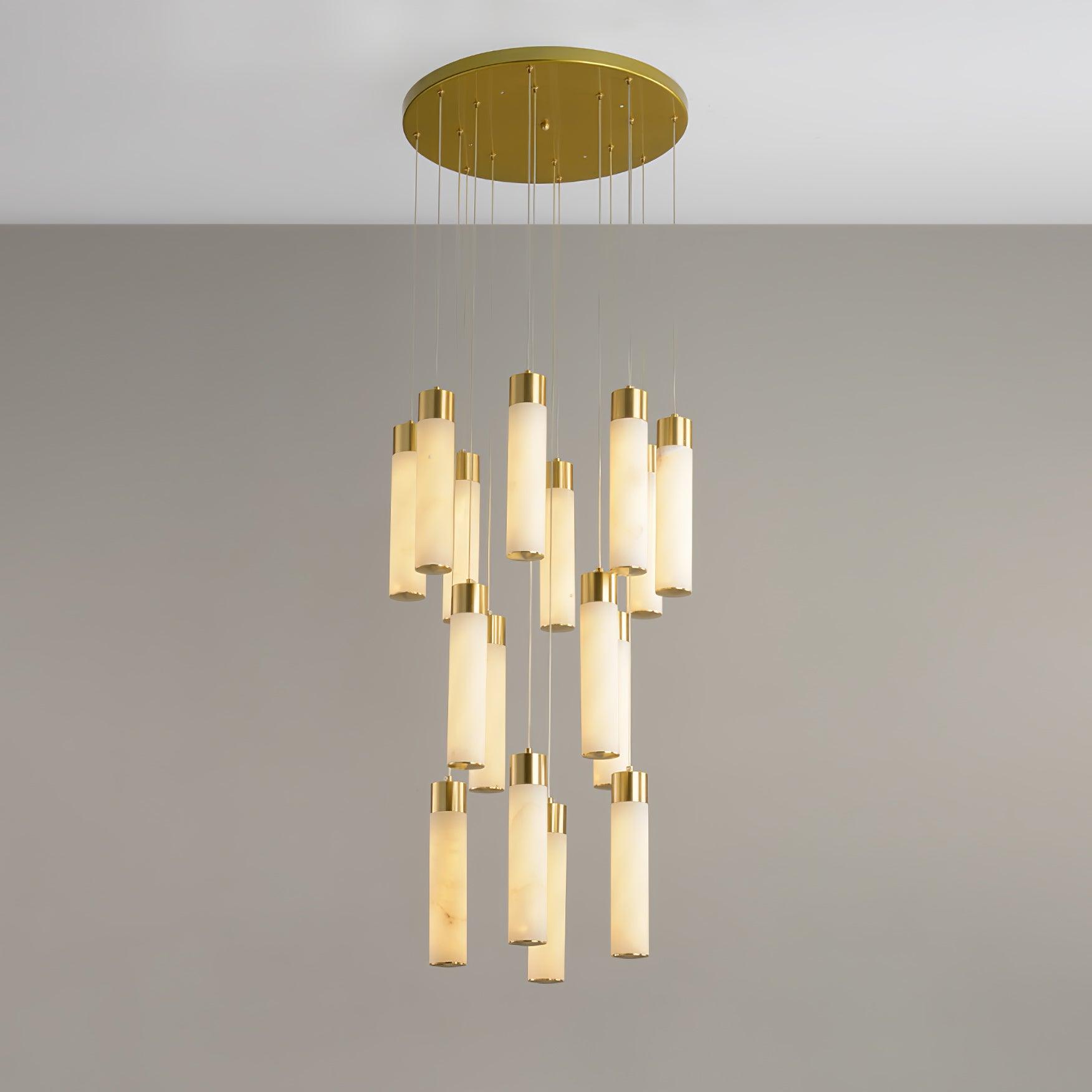 Dense Aurelia cluster viewed from slightly below, brass caps catching light above each stone tube.