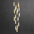 Aurelia cascade photographed against a dark charcoal wall so the lit alabaster stands out.