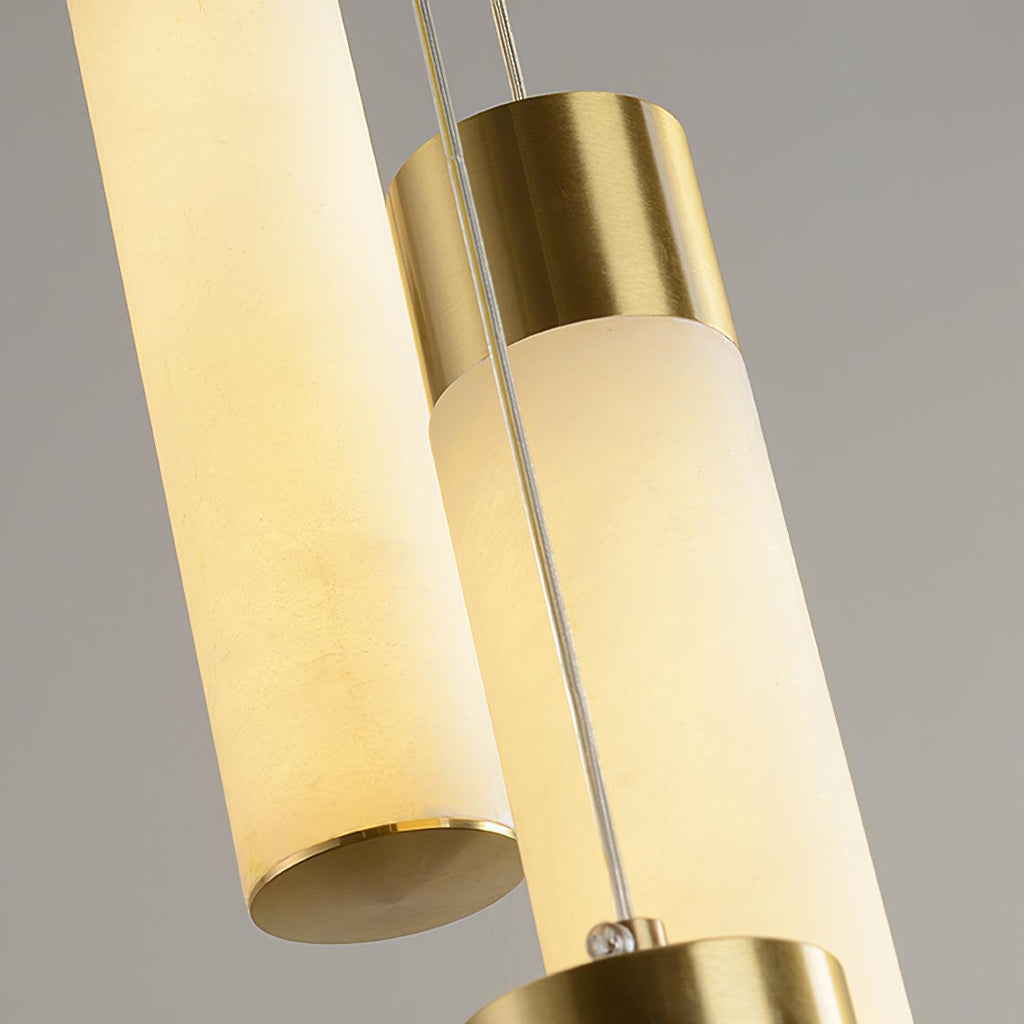 Detail of the brass collar and the open lower rim of an alabaster tube on the Aurelia chandelier.