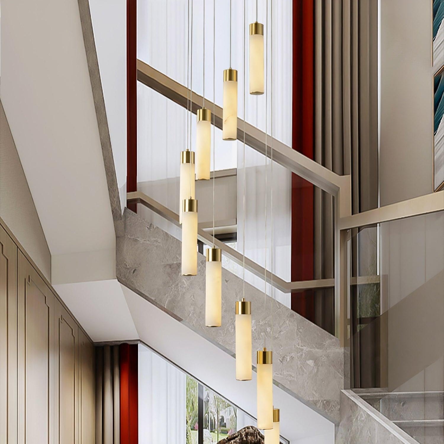 Aurelia cascade in a double-height entrance hall, hanging beside a marble and glass staircase.