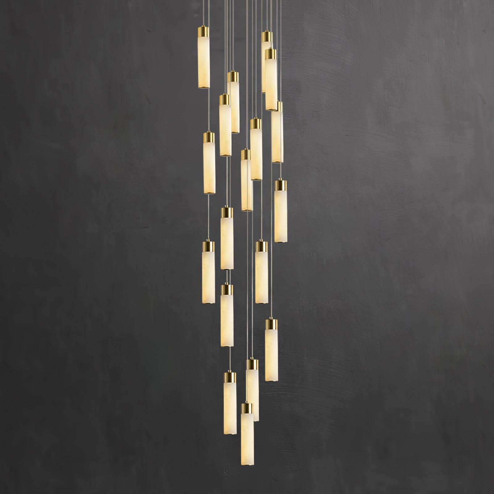 Full-length Aurelia spiral against a near-black wall, each stone tube glowing from within.