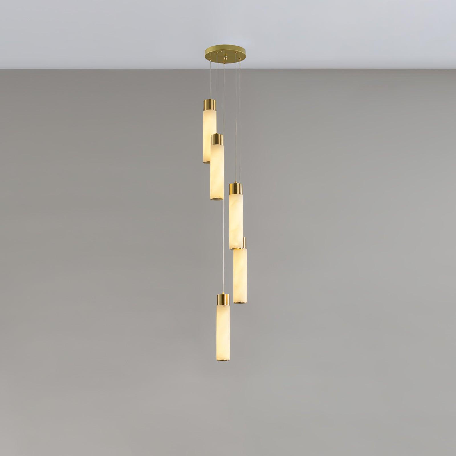 Five alabaster rods with brass collars hung in a loose spiral from a round ceiling plate.