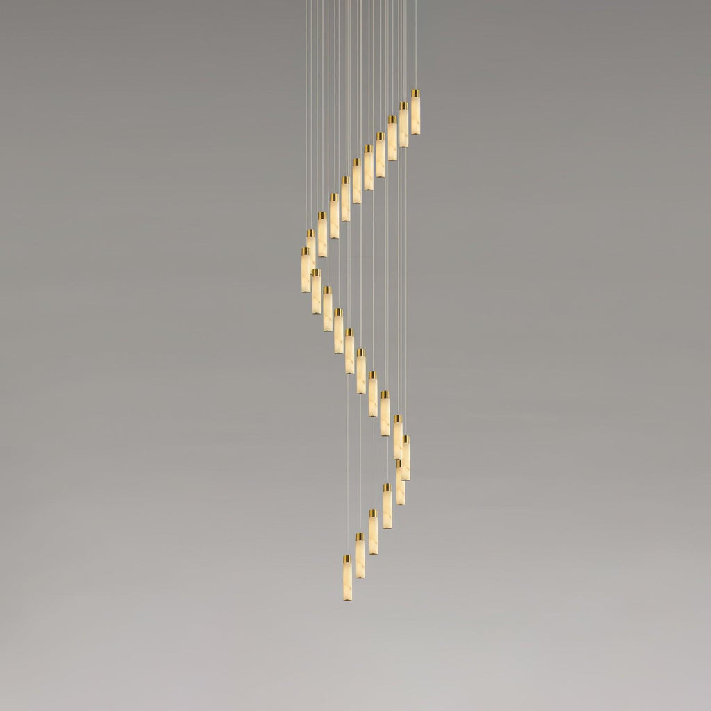 The full-height version, its rods winding down in a tall unbroken spiral against grey.