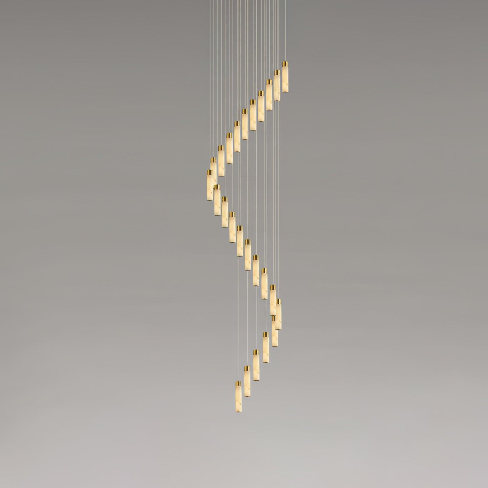 The full-height version, its rods winding down in a tall unbroken spiral against grey.