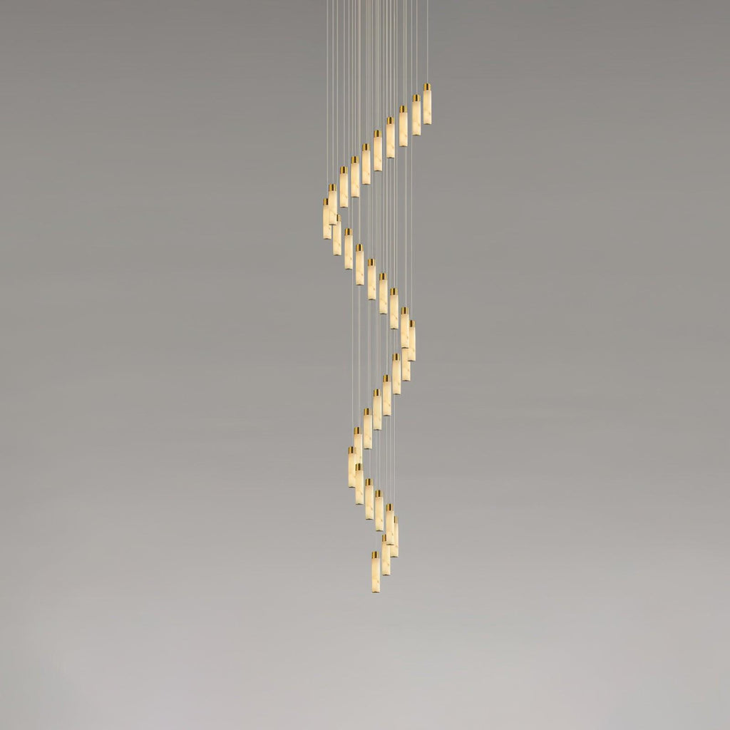 The largest spiral shown end to end, alabaster rods curling from the ceiling plate downward.
