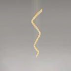 The largest spiral shown end to end, alabaster rods curling from the ceiling plate downward.