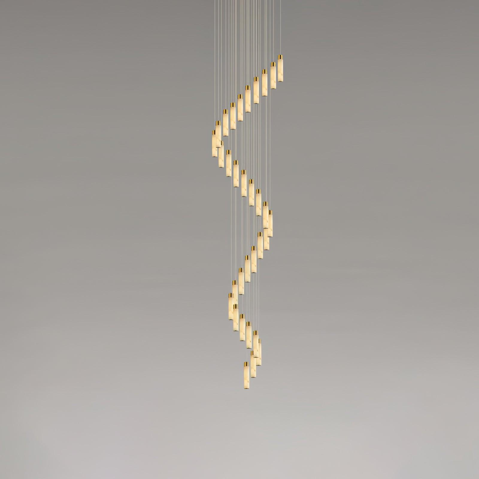 The largest spiral shown end to end, alabaster rods curling from the ceiling plate downward.