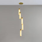 Five rods hung in a shallow spiral on grey, the simplest of the configurations.