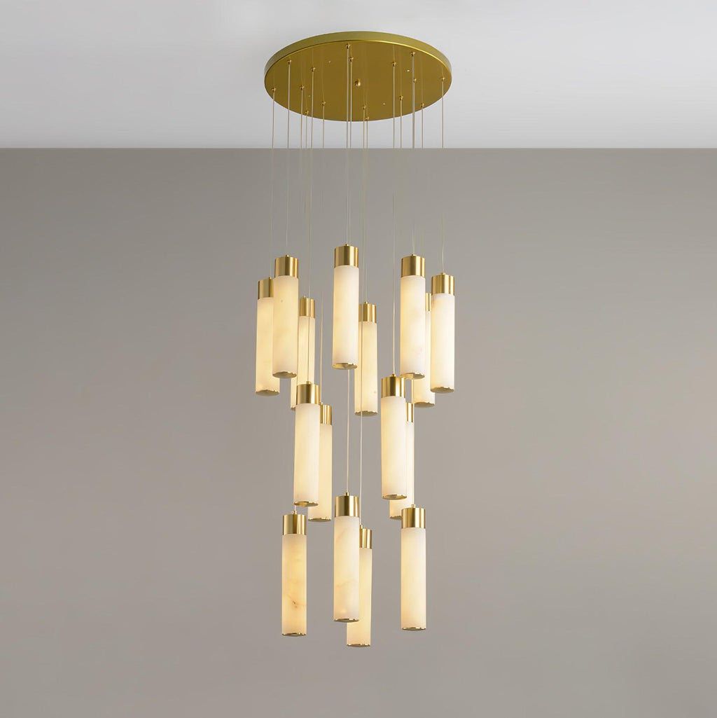 A fifteen-rod cluster on grey, the tubes lit so their alabaster grain shows.