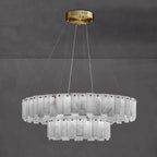 Aero round chandelier on a plain grey background, cool grey-veined alabaster panels held by metal studs