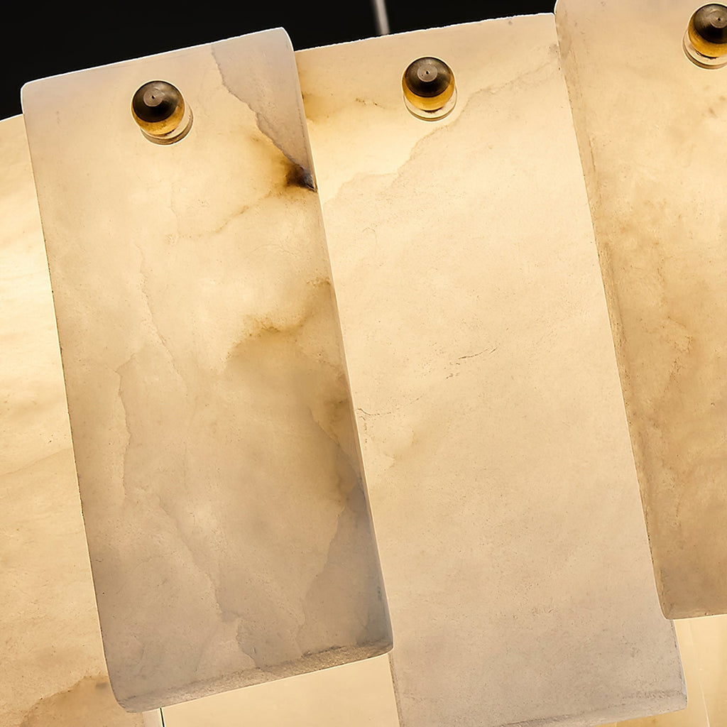 Tight crop of the Aero chandelier lit, showing light passing through the veined alabaster panels