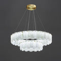 Two-tier Aero chandelier shown against dark grey, brass studs pinning each hand-shaped alabaster panel