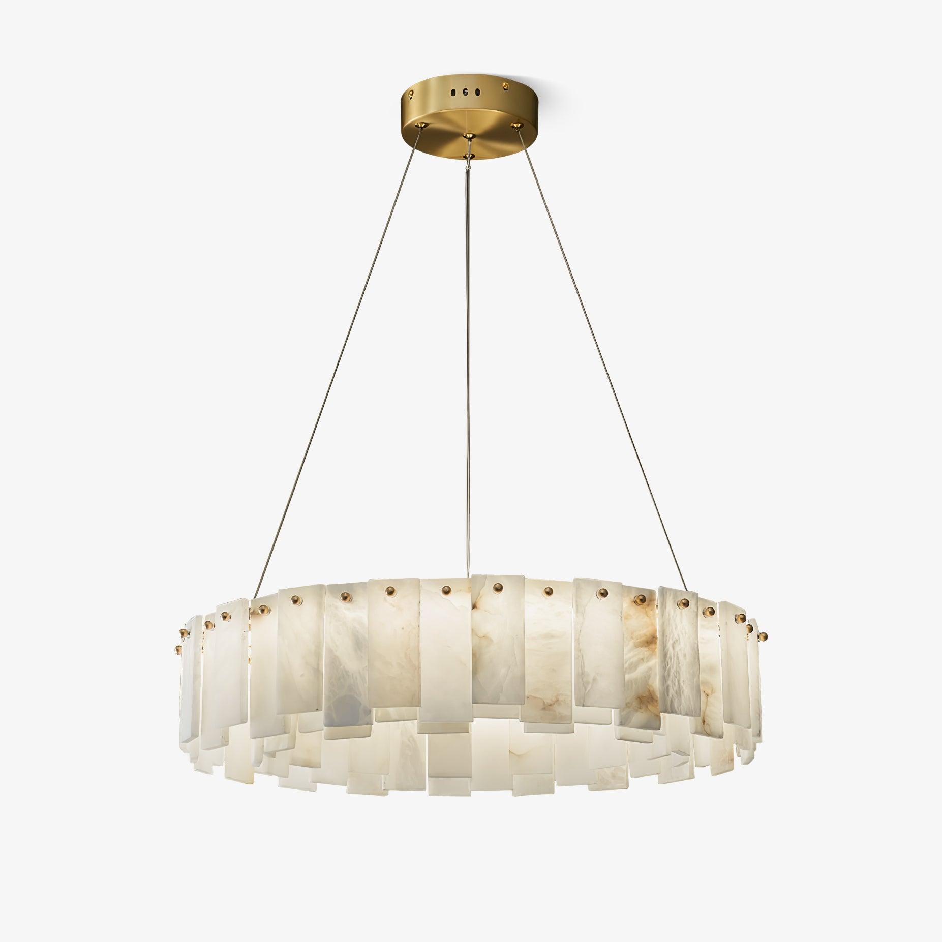 The drum chandelier on pale grey, hung on fine cables from a round brass ceiling plate.