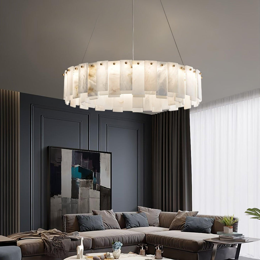 Lit above a sofa in a navy-panelled living room, with a large abstract canvas behind.