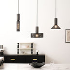 Slim cylinder cement mesh pendant light shown on its own