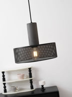Cement mesh pendant light shape with narrow black cage