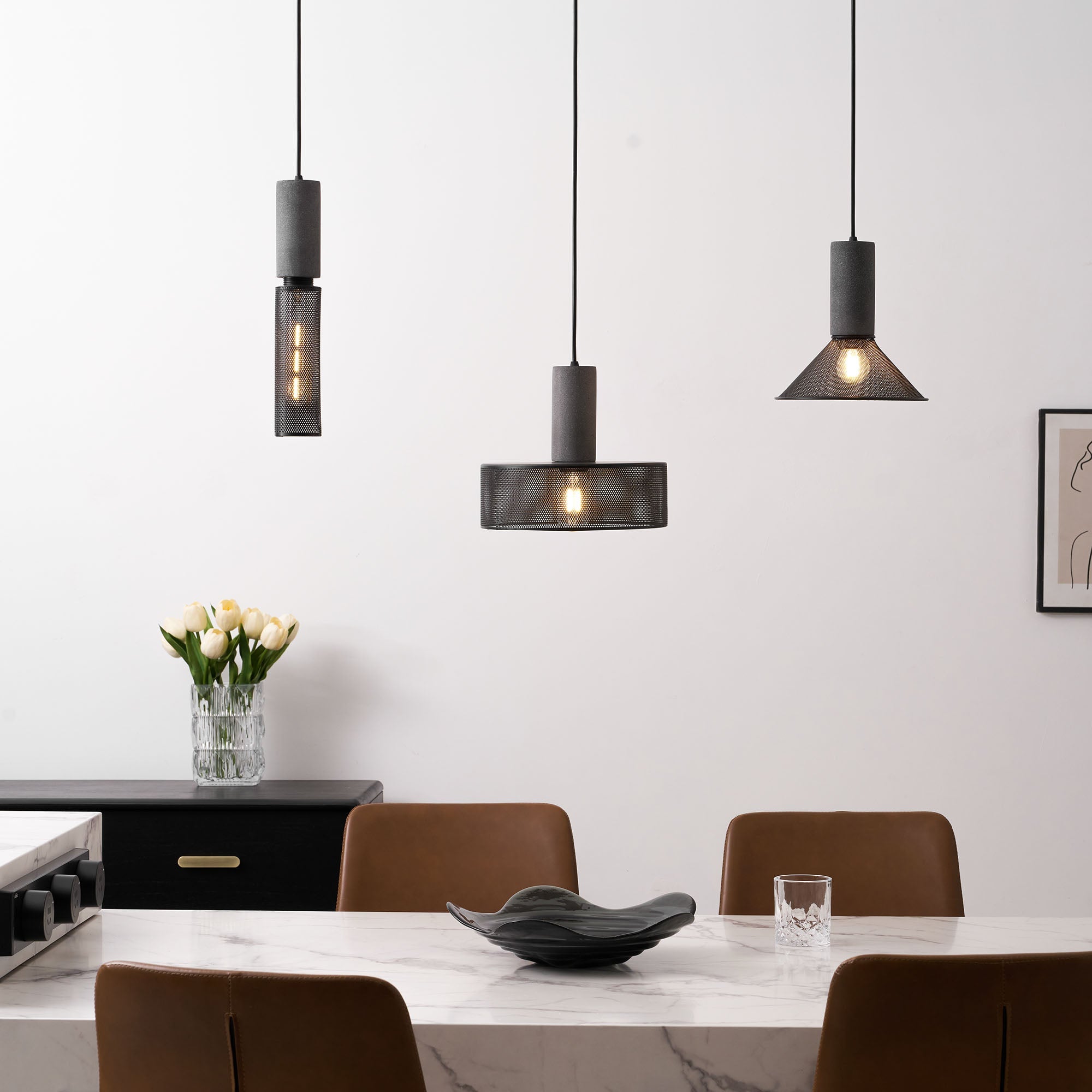 Tapered cement mesh pendant light against a plain background