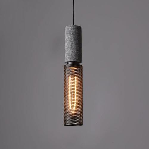Cement-top pendant light with black wire cage over a kitchen island