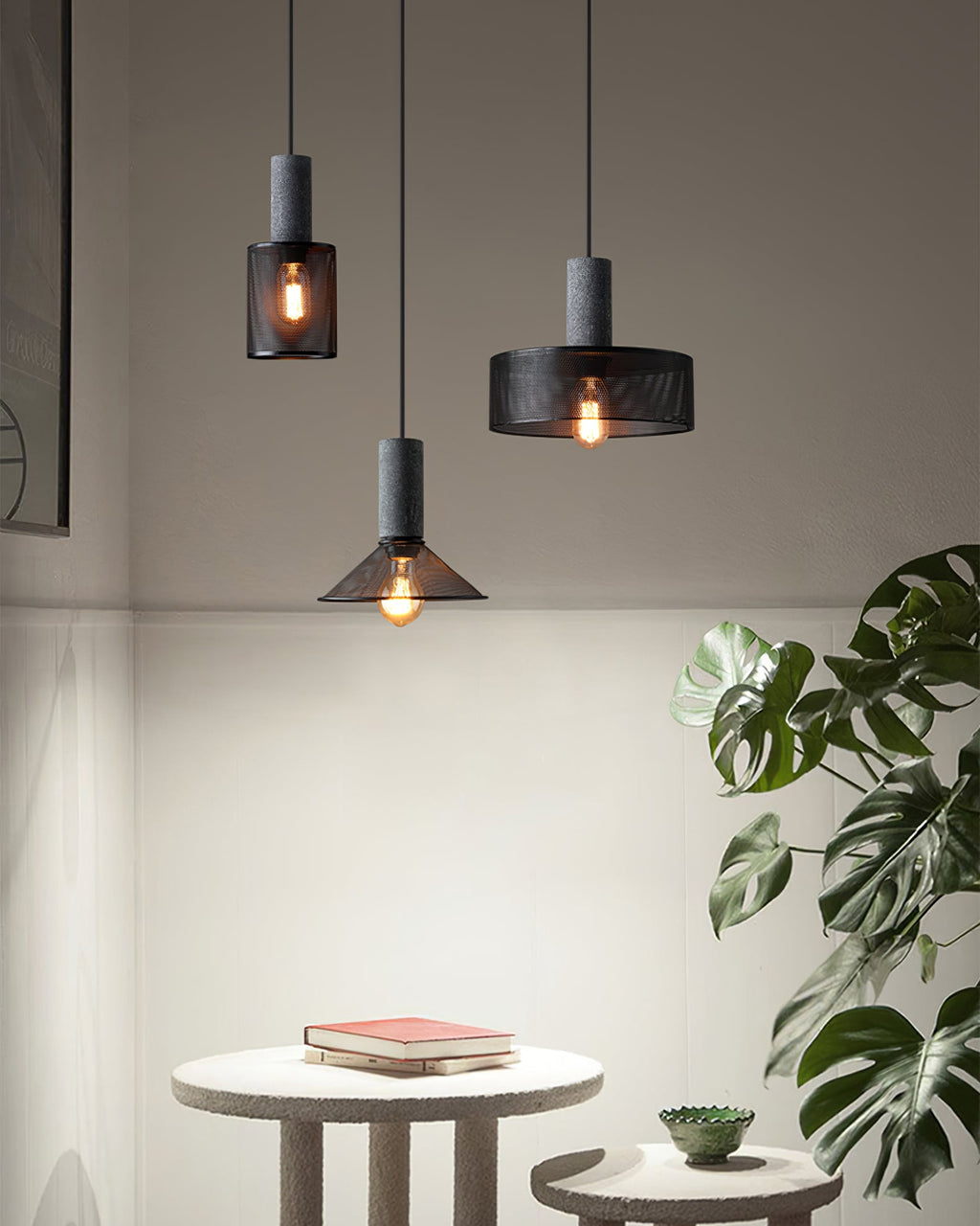 Cement mesh pendant light glowing over a kitchen worktop