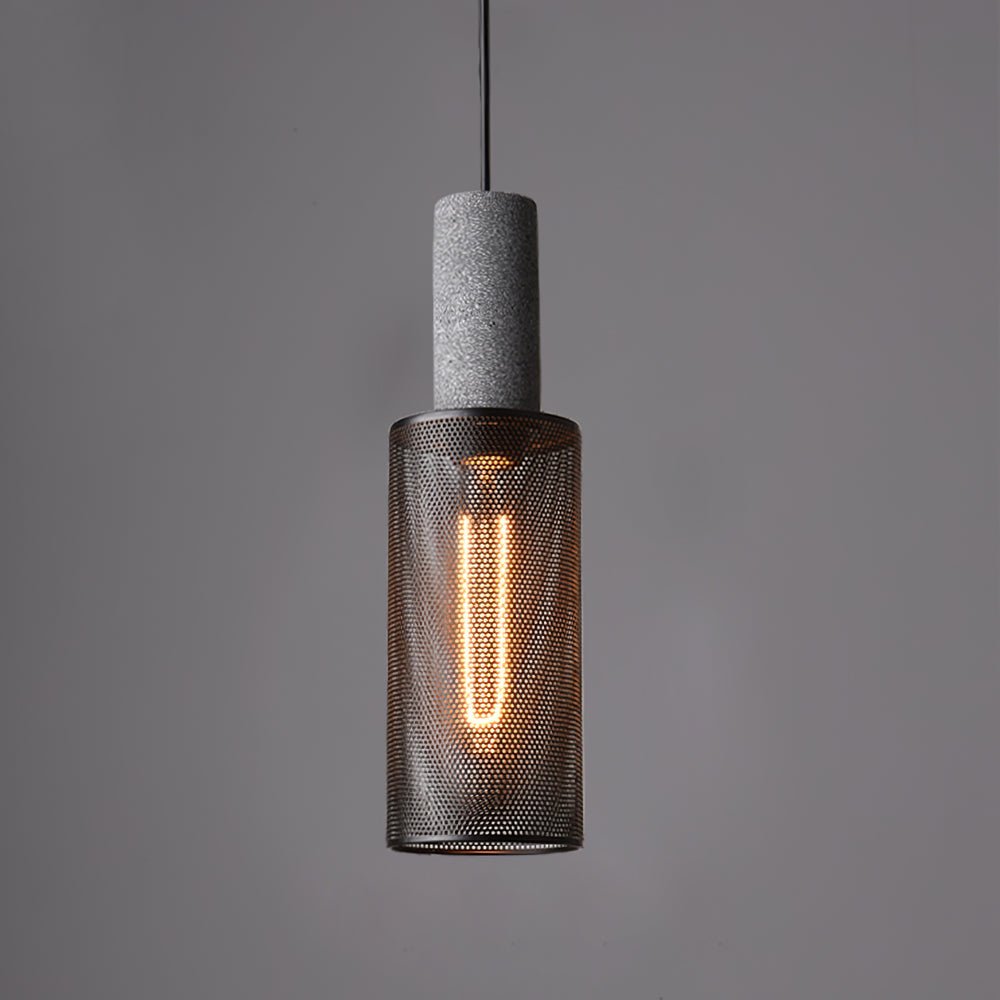 Black mesh pendant light casting shadow patterns on a wall