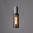 Black mesh pendant light casting shadow patterns on a wall
