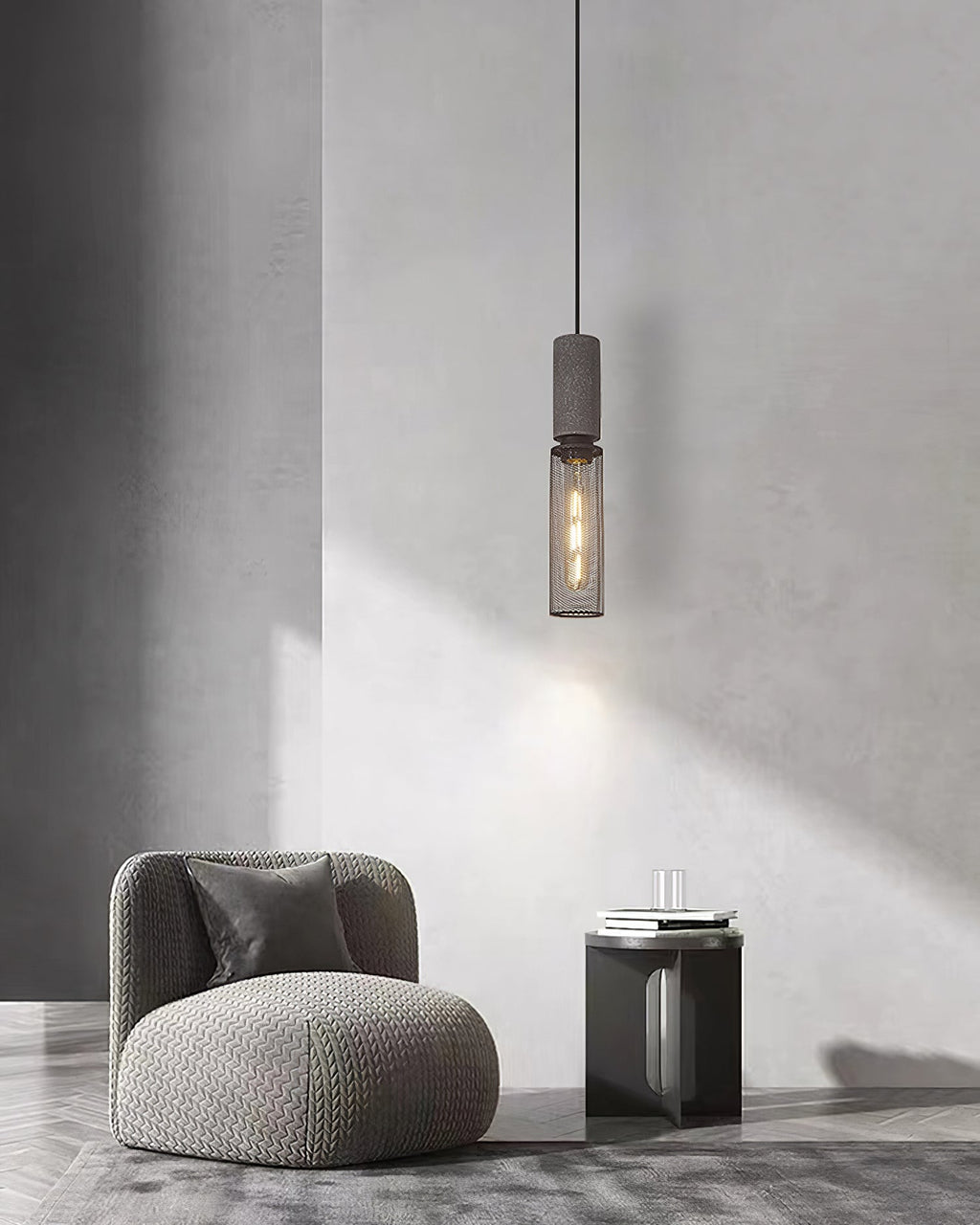 Cement-top pendant light with bare bulb and black wire cage